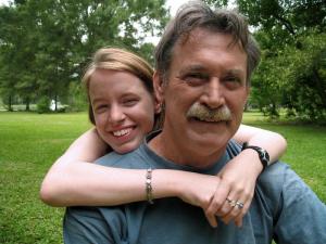 Young women hugging father